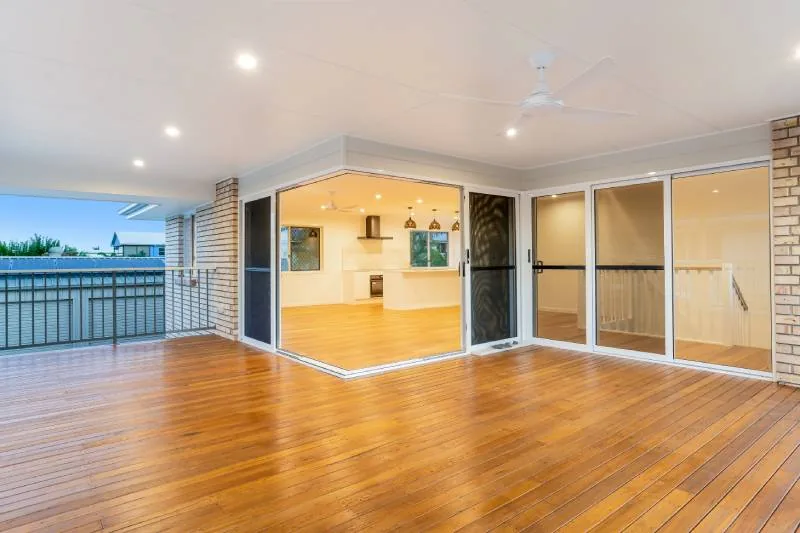 Living room with hardwood floors and sliding doors opening to the deck
